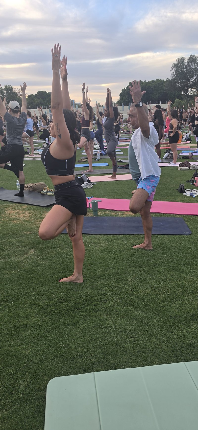 Outdoor yoga class at sunset